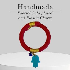 Red and Gold Bracelet with Blue Charm